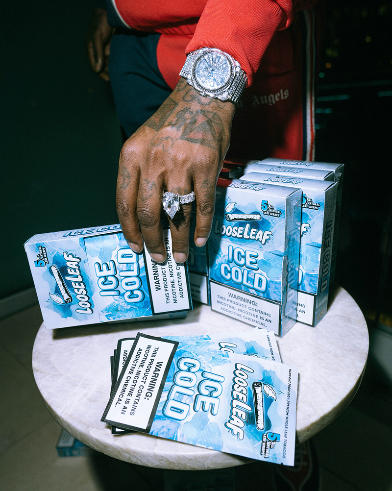 GUCCI MANE holding a box of Looseleaf Ice Cold