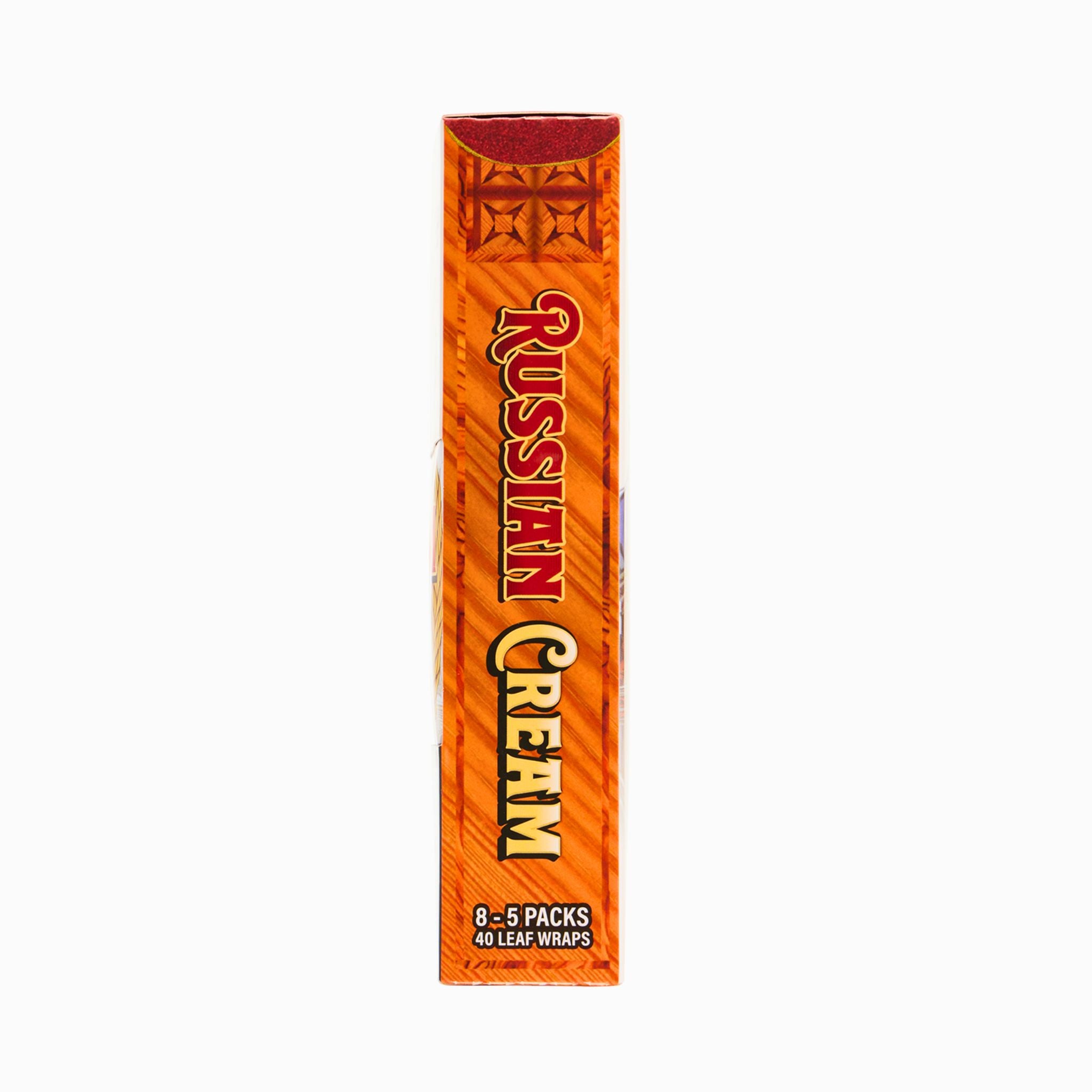 Side view of LooseLeaf Russian Cream Wraps box with a rich woodgrain background and bold red and gold typography.